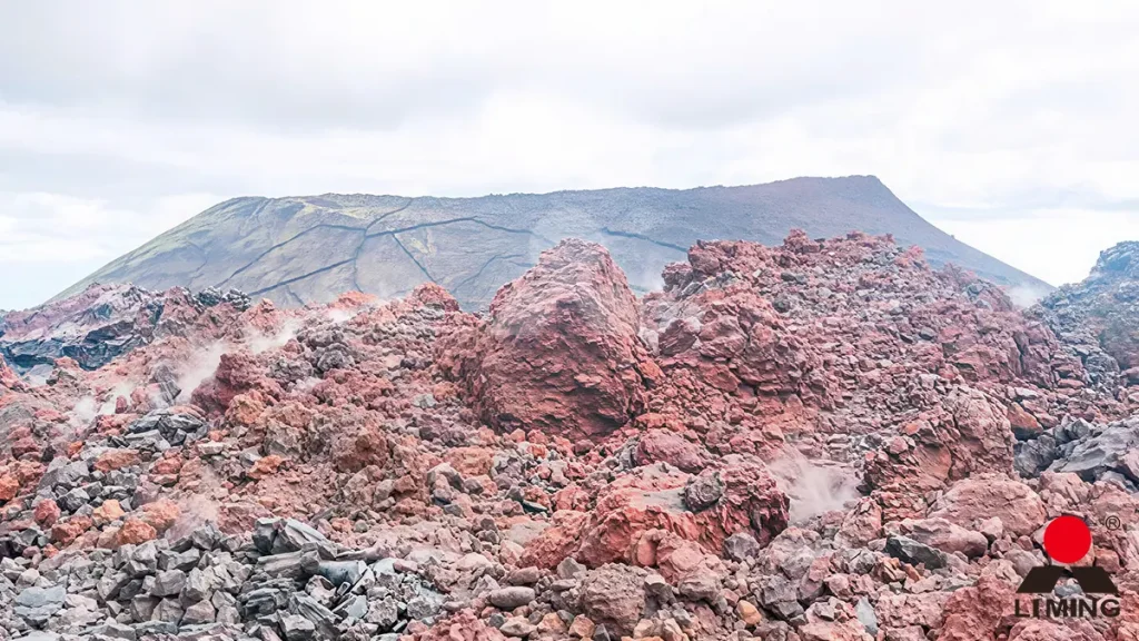 Raw porous tuff volcanic rock processed into clean manufactured sand